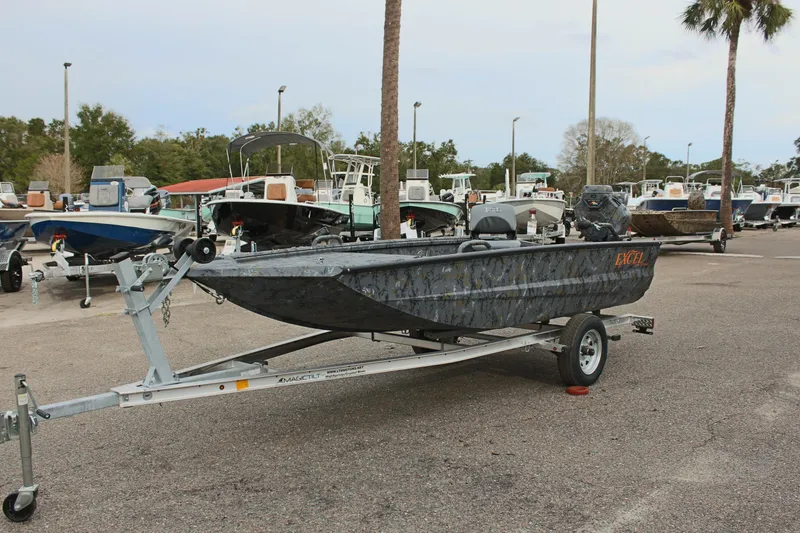 Slide: The Image of 2025 Excel Eclipse 1554 boat on trailer in marina parking lot. - 5