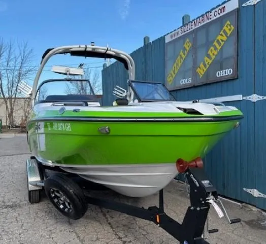 Slide: The Image of 2021 Yamaha Boats 212XE in vibrant green on trailer at Sizzle Marine, Ohio. - 1