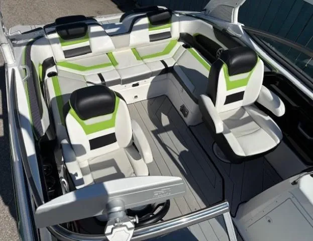Slide: The Image of Interior of 2021 Yamaha Boats 212XE with modern seating and sleek design. - 14