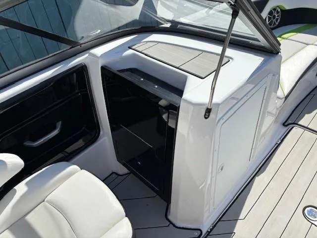 Slide: The Image of 2021 Yamaha Boats 212XE interior, featuring sleek seating and modern design elements. - 15