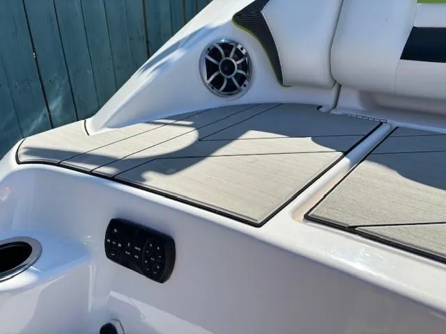 Slide: The Image of 2021 Yamaha Boats 212XE interior with speaker and control panel. - 25