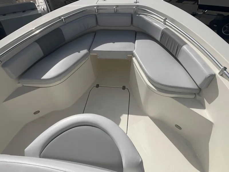 Slide: The Image of 2021 Cobia 237 Center Console boat with spacious seating area. - 5
