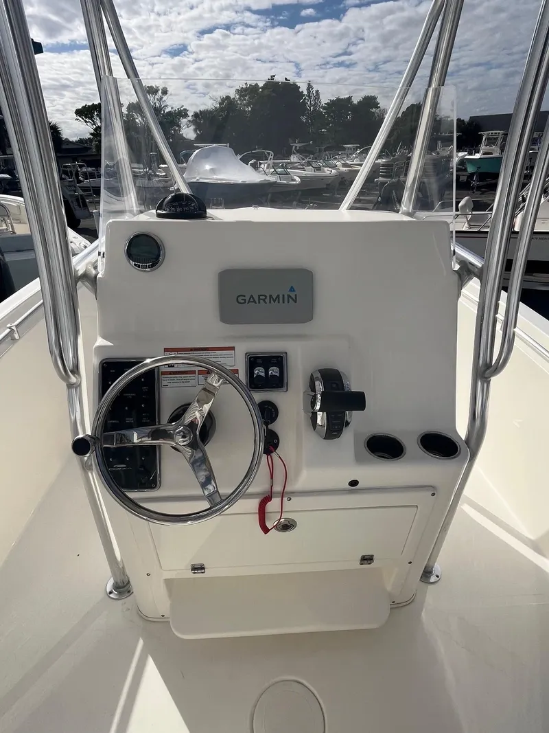 Slide: The Image of 2021 Cobia 237 Center Console boat dashboard with Garmin navigation system. - 6