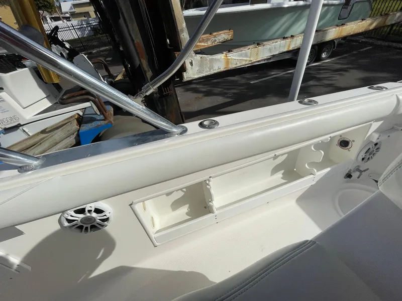 Slide: The Image of 1997 Wellcraft 302 boat interior with storage compartment and speaker. - 10