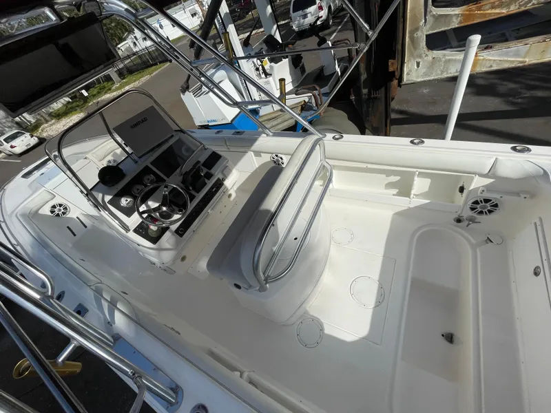 Slide: The Image of 1997 Wellcraft 302 boat interior with steering console and seating area. - 13