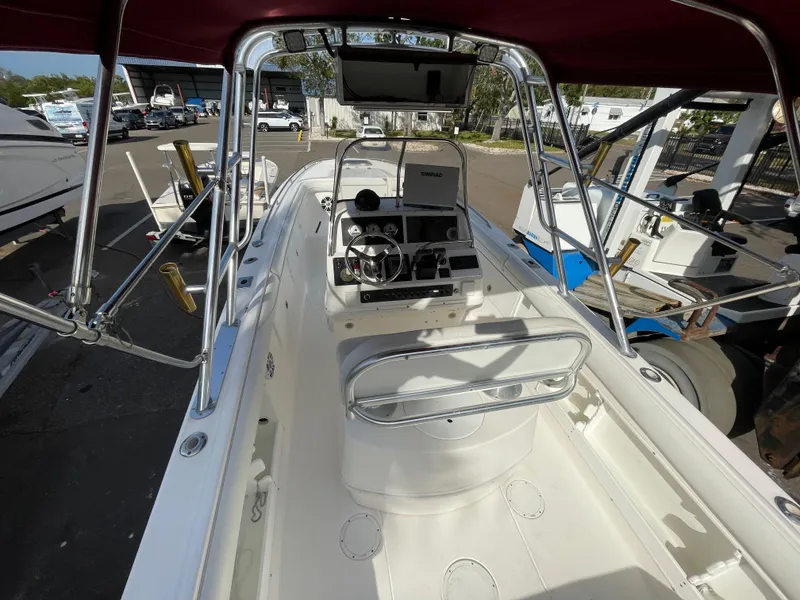 Slide: The Image of 1997 Wellcraft 302 boat interior with steering console and canopy. - 15