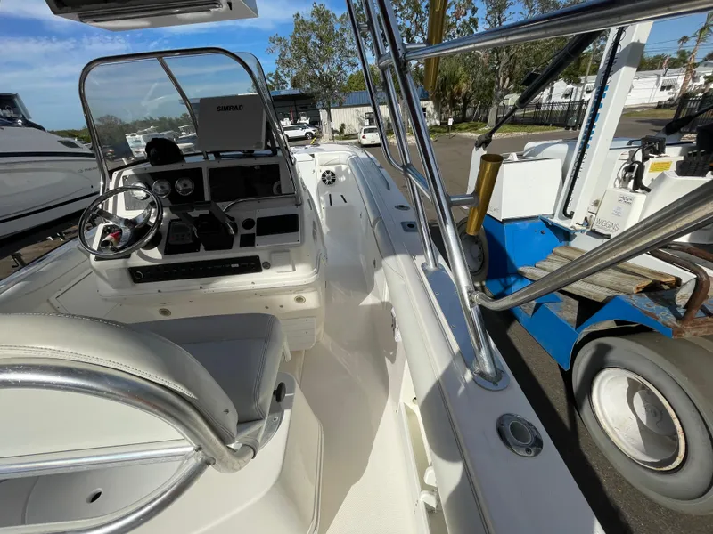 Slide: The Image of Interior view of a 1997 Wellcraft 302 boat with steering console and seating. - 18