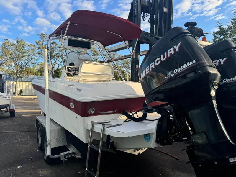Slide: The Image of 1997 Wellcraft 302 boat with Mercury OptiMax engines on a trailer. - 4
