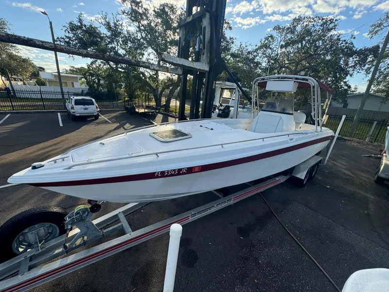 Slide: The Image of 1997 Wellcraft 302 boat on trailer in parking lot, sunny day. - 5
