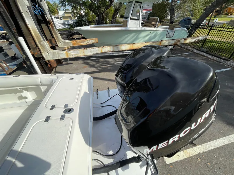Slide: The Image of 1997 Wellcraft 302 boat with dual Mercury outboard engines in a parking lot. - 6