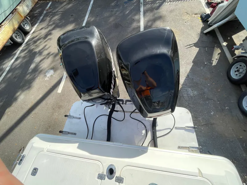 Slide: The Image of Overhead view of dual outboard motors on a 1997 Wellcraft 302 boat. - 7
