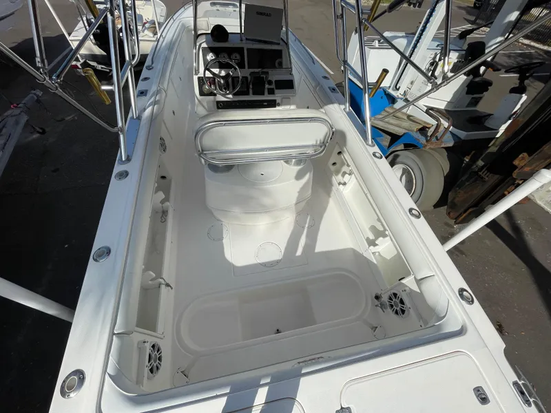 Slide: The Image of 1997 Wellcraft 302 boat interior with steering console and seating area. - 9