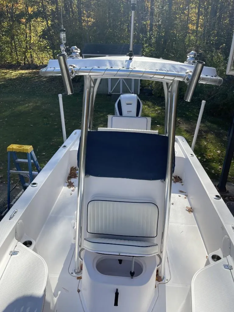 Slide: The Image of 2009 Pro-Line 23 Bay boat with T-top, viewed from above, in a wooded area. - 9