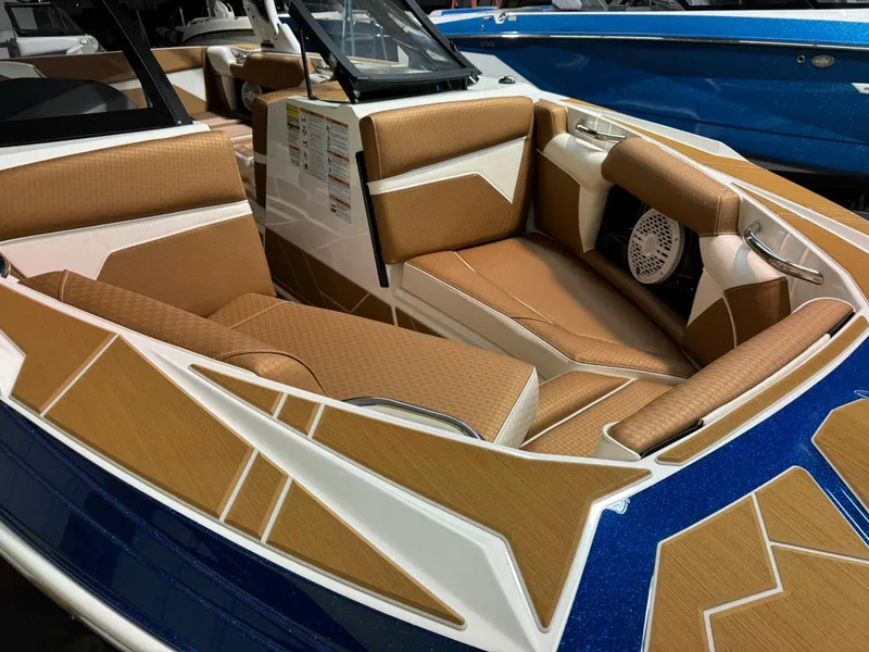Slide: The Image of 2024 Supreme S220 boat interior with tan and white seating, modern design. - 43