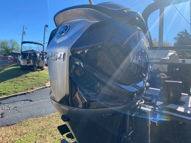 Slide: The Image of 2025 SunCatcher Select 324SS boat with powerful outboard motor in sunlight. - 17