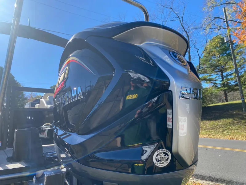 Slide: The Image of 2025 SunCatcher Select 324SS boat engine, sleek design, outdoors on a sunny day. - 19