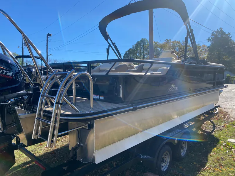 Slide: The Image of 2025 SunCatcher Select 324SS pontoon boat on trailer, sunny day. - 3