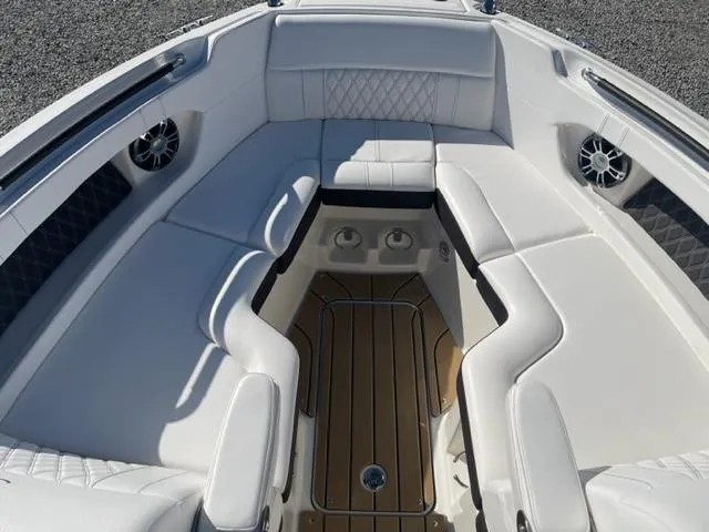 Slide: The Image of Luxurious seating area on 2022 Sea Ray SLX 280 boat with elegant white upholstery. - 15