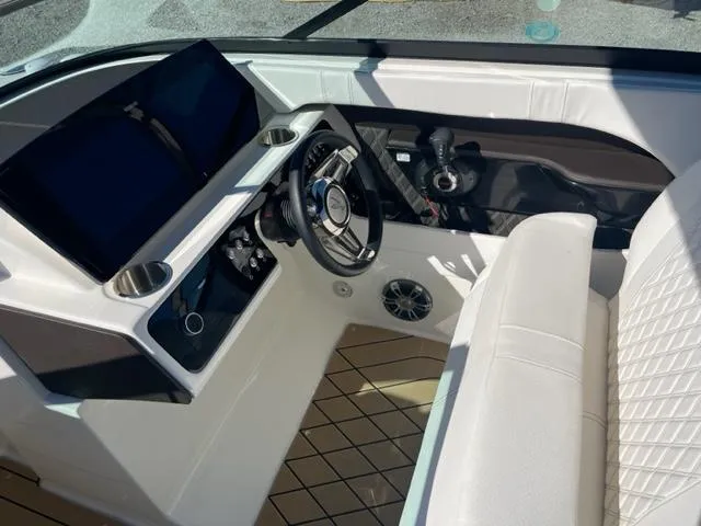 Slide: The Image of 2022 Sea Ray SLX 280 boat interior with steering wheel and dashboard controls. - 5