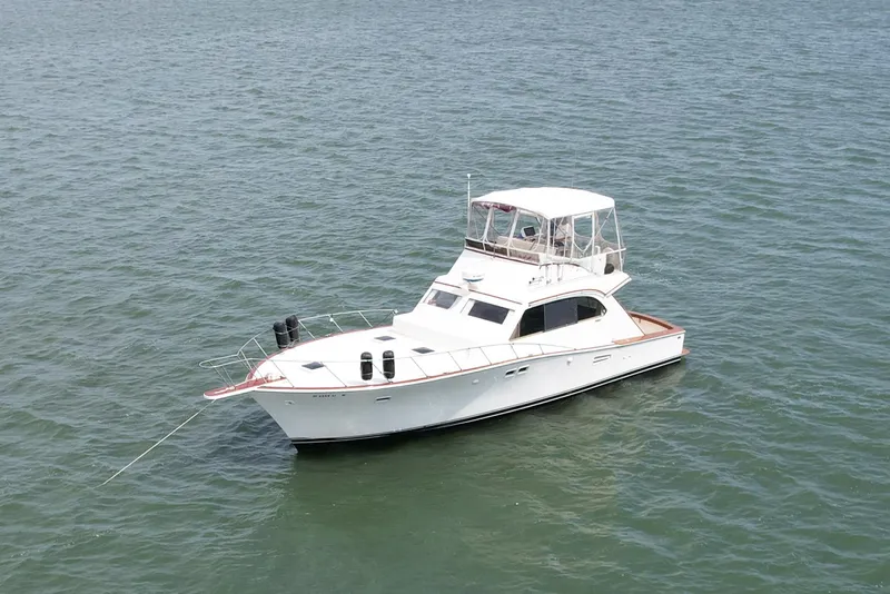 Slide: The Image of 1981 Post 46 Sportfish boat on calm water. - 10