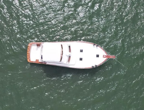 Slide: The Image of Aerial view of 1981 Post 46 Sportfish boat on water. - 15