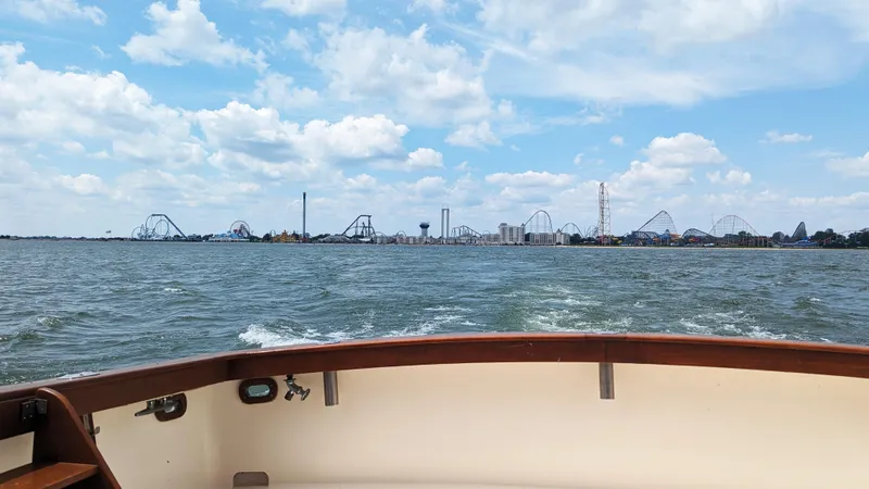 Slide: The Image of View from 1981 Post 46 Sportfish boat, amusement park skyline in the distance. - 18