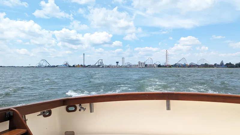 Slide: The Image of View from 1981 Post 46 Sportfish boat, amusement park skyline in distance, sunny day. - 21