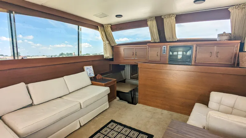 Slide: The Image of Interior of 1981 Post 46 Sportfish yacht with cozy seating and vintage TV. - 27