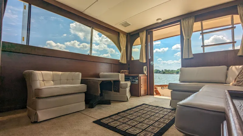 Slide: The Image of Interior of 1981 Post 46 Sportfish yacht with plush seating and scenic windows. - 29