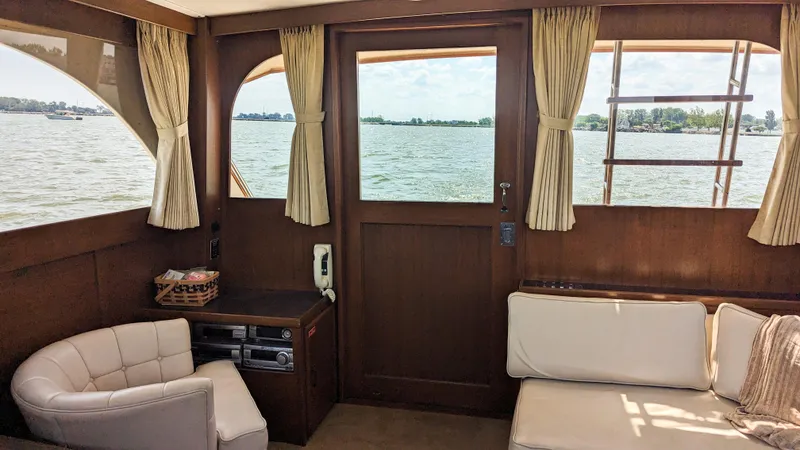 Slide: The Image of Interior of 1981 Post 46 Sportfish yacht with lake view through windows. - 33