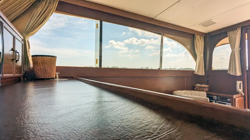 Slide: The Image of Interior view of 1981 Post 46 Sportfish yacht with large windows and curtains. - 34