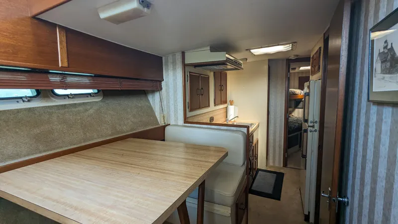 Slide: The Image of Interior of 1981 Post 46 Sportfish yacht with dining area and cozy cabin. - 37