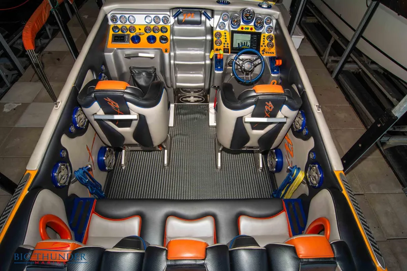 Slide: The Image of Interior of 2007 Cigarette 42X boat with advanced dashboard and seating. - 14