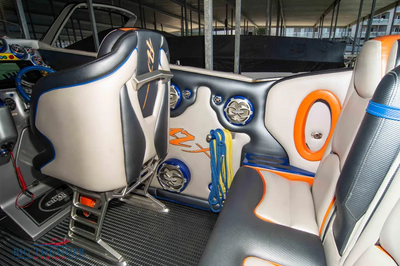 Slide: The Image of Interior of 2007 Cigarette 42X boat with modern seating and vibrant accents. - 16