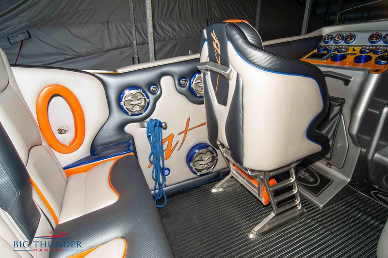 Slide: The Image of 2007 Cigarette 42X boat interior with custom seating and vibrant orange accents. - 17