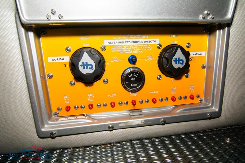 Slide: The Image of Control panel of a 2007 Cigarette 42X boat with switches and indicators. - 19