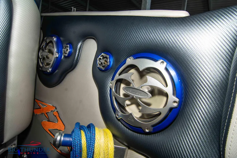 Slide: The Image of 2007 Cigarette 42X boat interior with blue speakers and carbon fiber accents. - 20