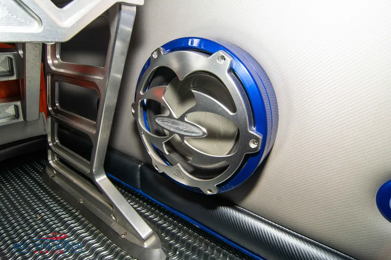 Slide: The Image of Close-up of a 2007 Cigarette 42X boat speaker with metallic and blue accents. - 21