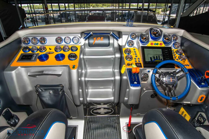 Slide: The Image of 2007 Cigarette 42X boat dashboard with vibrant gauges and controls. - 22