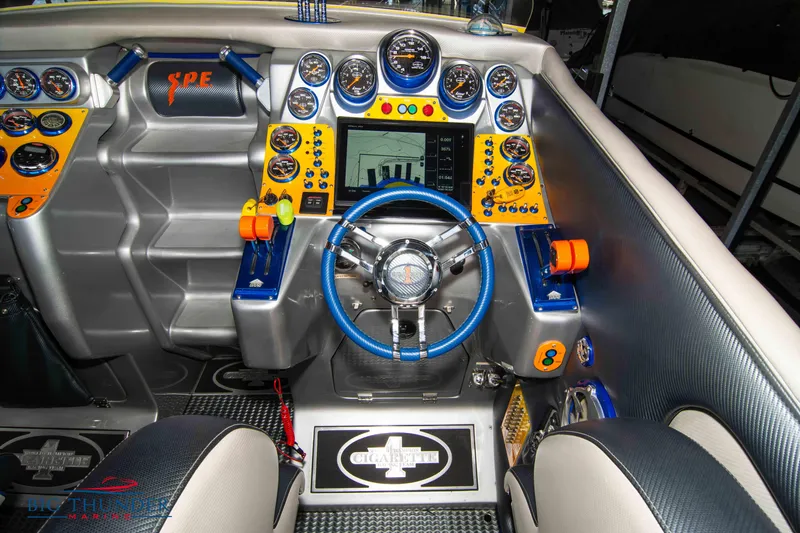 Slide: The Image of 2007 Cigarette 42X boat cockpit with advanced controls and vibrant dashboard. - 23