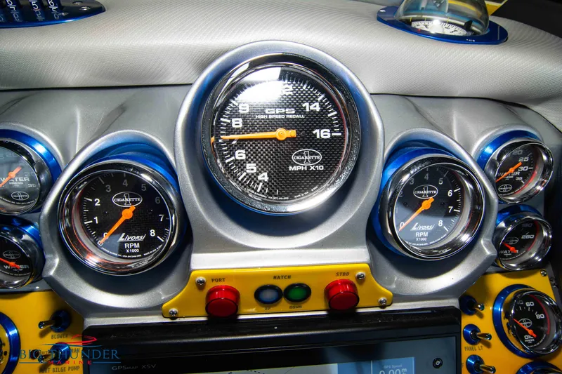Slide: The Image of Dashboard of 2007 Cigarette 42X boat with multiple gauges and controls. - 26