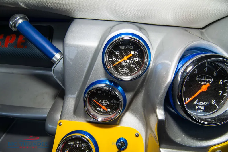 Slide: The Image of Close-up of 2007 Cigarette 42X dashboard gauges, featuring speedometer and RPM dials. - 27