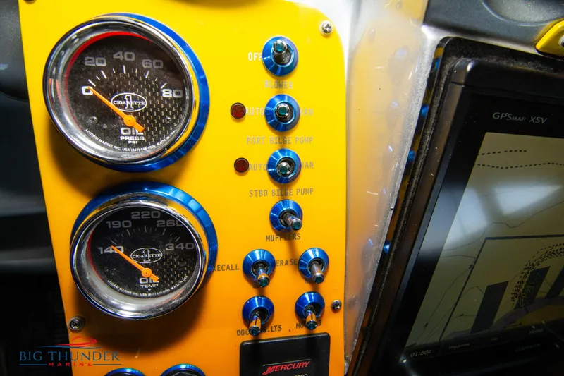 Slide: The Image of Dashboard of a 2007 Cigarette 42X boat with gauges and control switches. - 31