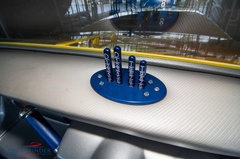 Slide: The Image of Dashboard of a 2007 Cigarette 42X boat with blue control levers. - 34