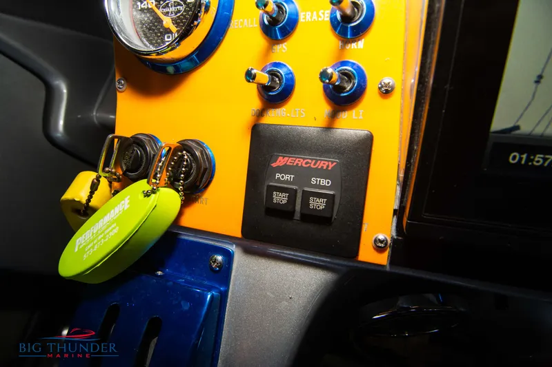 Slide: The Image of Control panel of a 2007 Cigarette 42X boat with Mercury engine switches. - 35