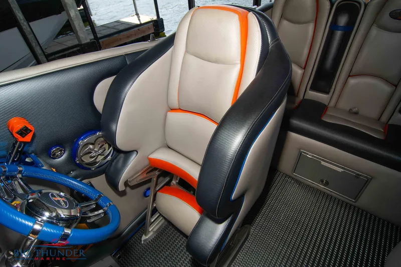 Slide: The Image of 2007 Cigarette 42X boat interior with sporty seat and vibrant steering wheel. - 39