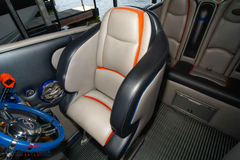 Slide: The Image of 2007 Cigarette 42X boat interior with stylish leather seating and modern steering wheel. - 40