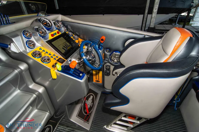 Slide: The Image of 2007 Cigarette 42X boat cockpit with advanced controls and gauges. - 43