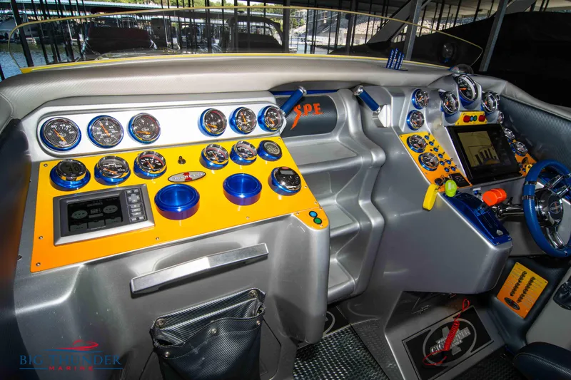 Slide: The Image of 2007 Cigarette 42X boat dashboard with vibrant gauges and controls. - 45