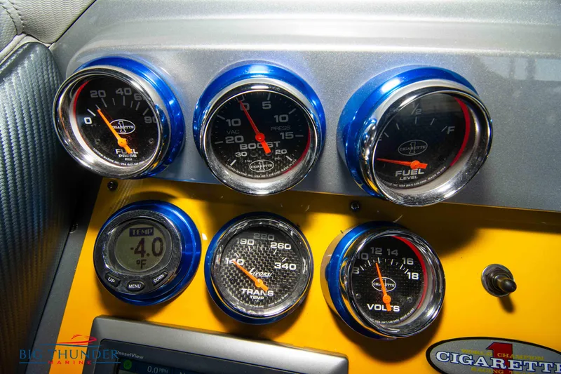 Slide: The Image of Dashboard gauges of a 2007 Cigarette 42X boat, featuring fuel, boost, and voltage indicators. - 48